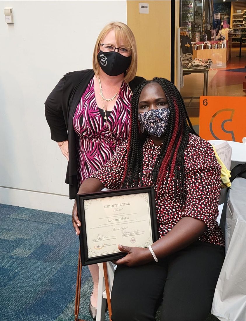 Romana Mutai holding award next to Bethany Toledo