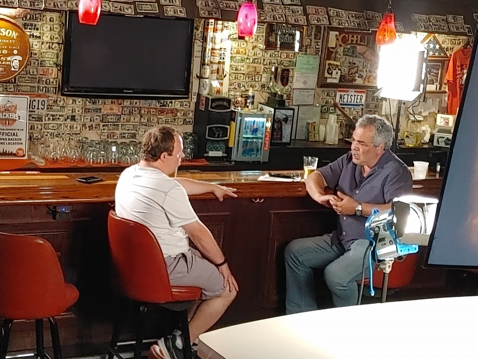 Mike Messina and Dino Tripodis sitting in a bar