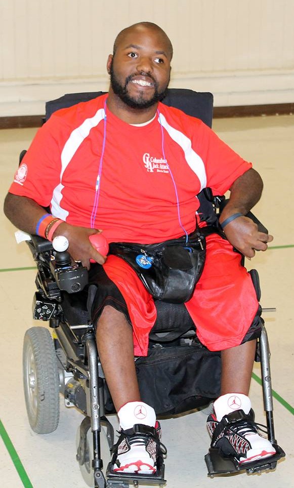 Cornelius Oatis in his wheelchair, smiling